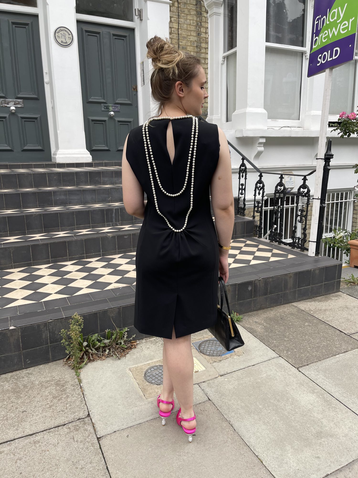 black dress with pearls